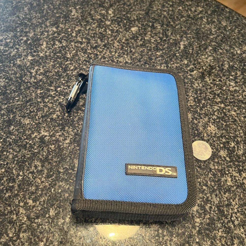 NINTENDO DS GAME HOLDER. Can hold games and DS TOO. Good condition